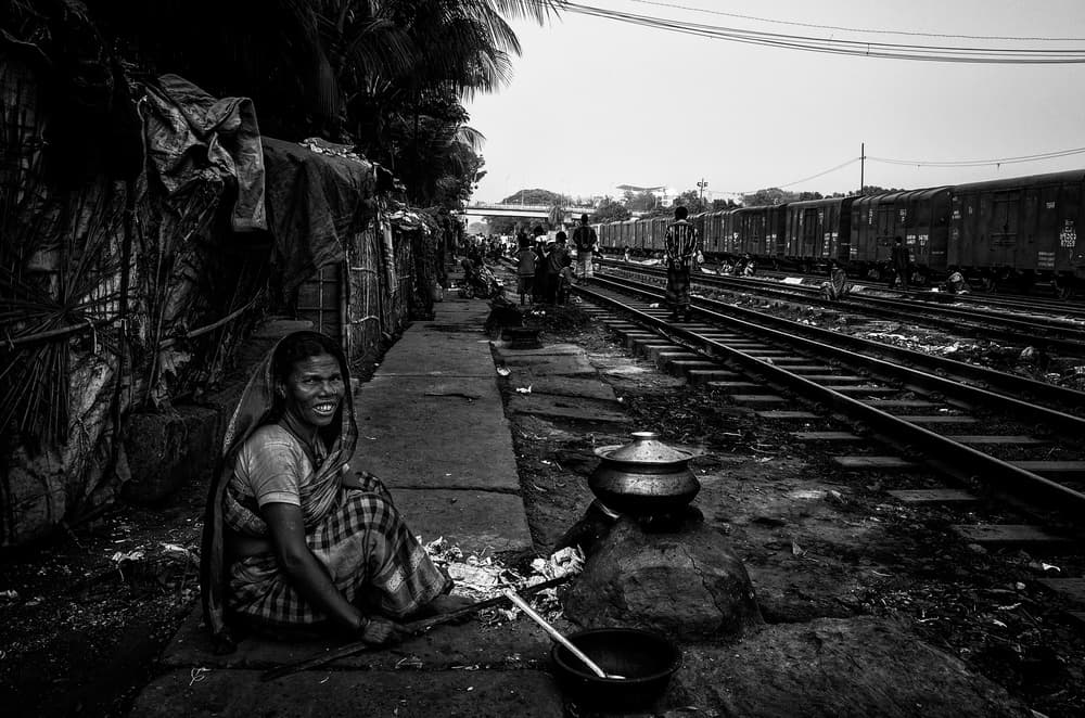 Woman Cooking Trackside by Joxe Inazio Kuesta Garmendia — canvas wall art