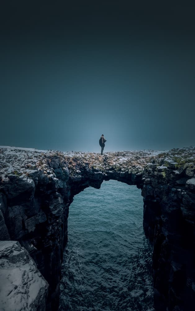Lone Figure Sea Arch by YANGYING — canvas wall art