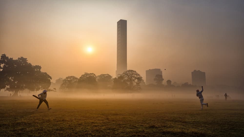 Misty Morning Cricket Game by Som Prasad — canvas wall art