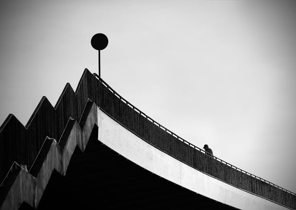 Solitary Figure on Bridge by Anna Niemiec — canvas wall art