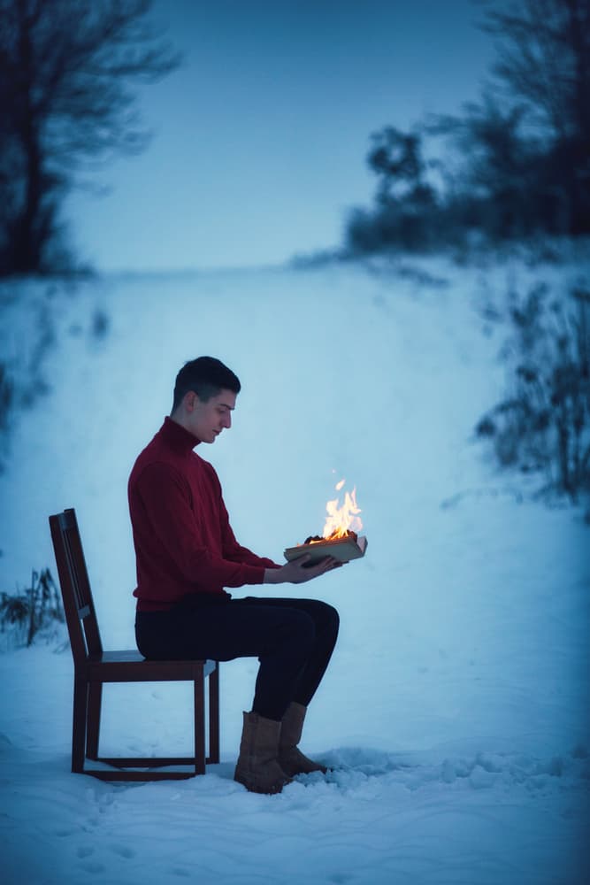 Man With Fire In Snow by Magdalena Russocka — canvas wall art