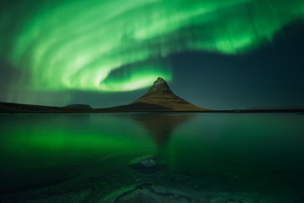Green Aurora Over Kirkjufell by David Martin Castan — canvas wall art