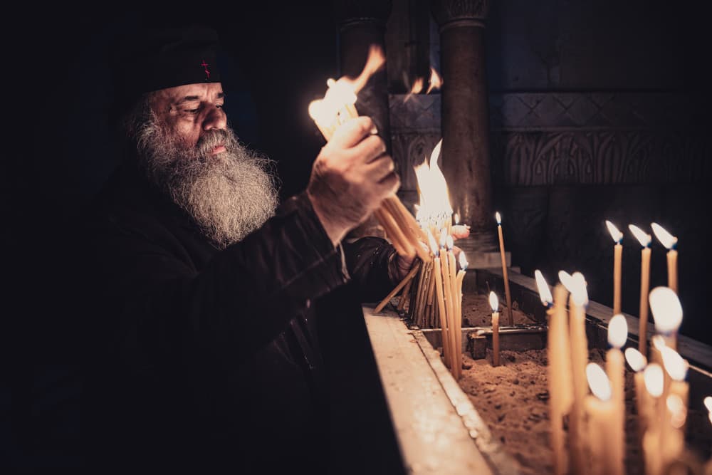Monk Lighting Candles by Marco Tagliarino — canvas wall art