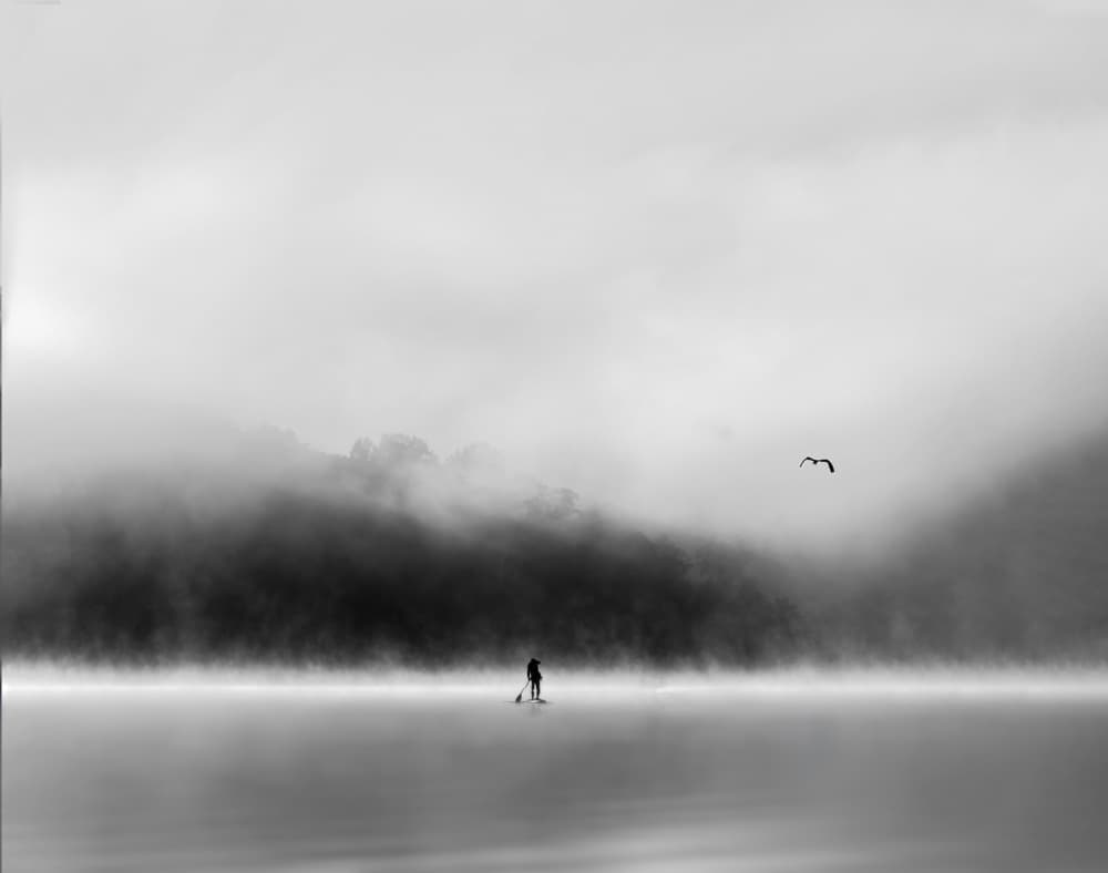Misty Lake Paddleboarder by Rae Zhang — canvas wall art