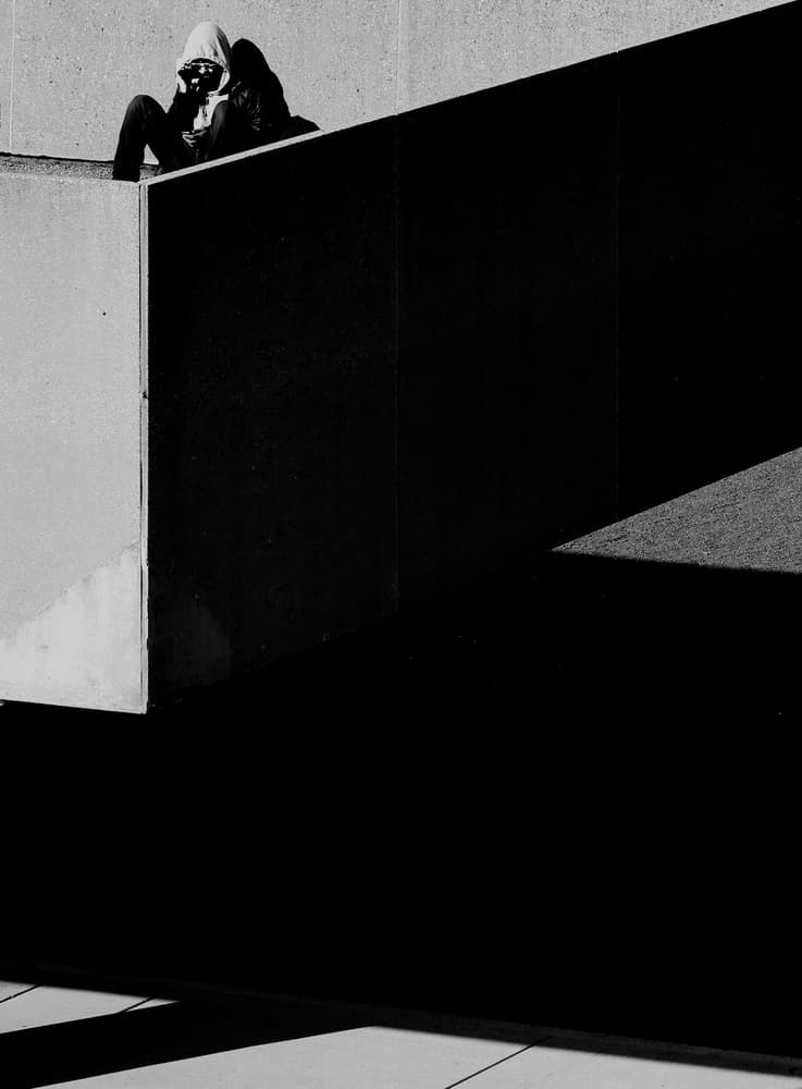Hooded Figure in Shadows by Jian Wang — canvas wall art