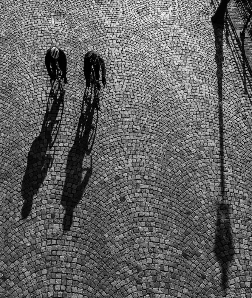 Cyclists And Shadows by Colin Dixon — canvas wall art
