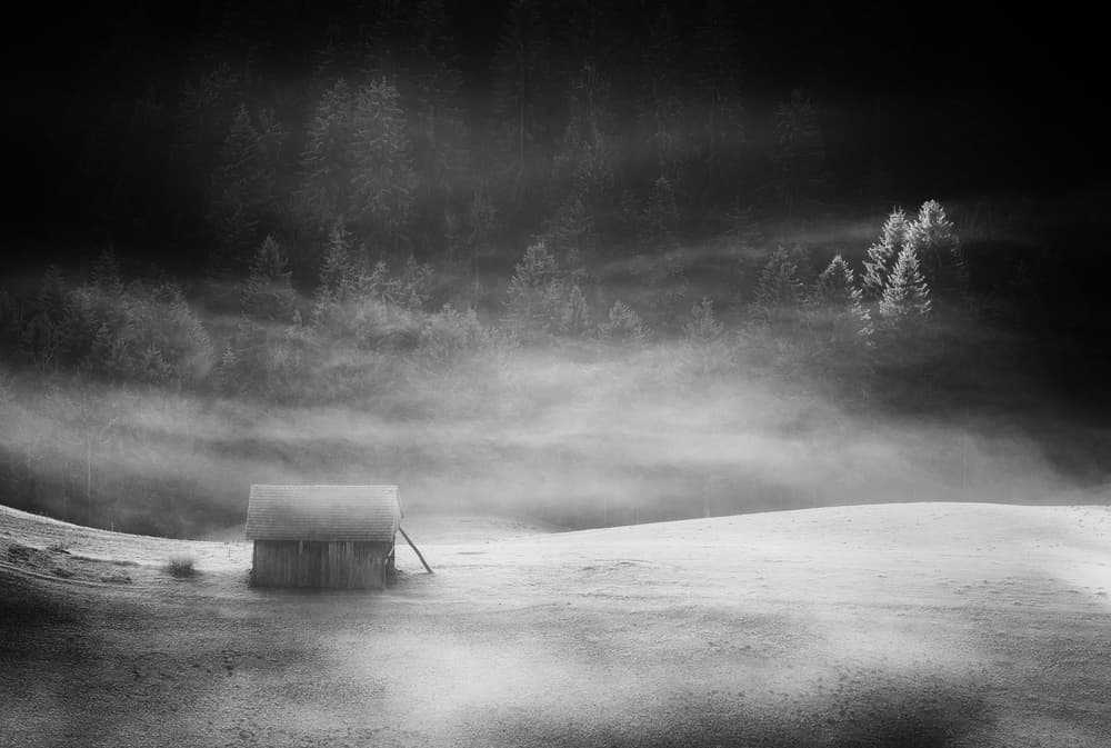 Misty Winter Cabin by Ales Komovec — canvas wall art