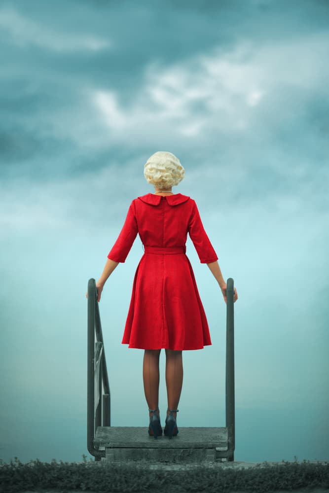 Woman in Red by Water by Ildiko Neer — canvas wall art