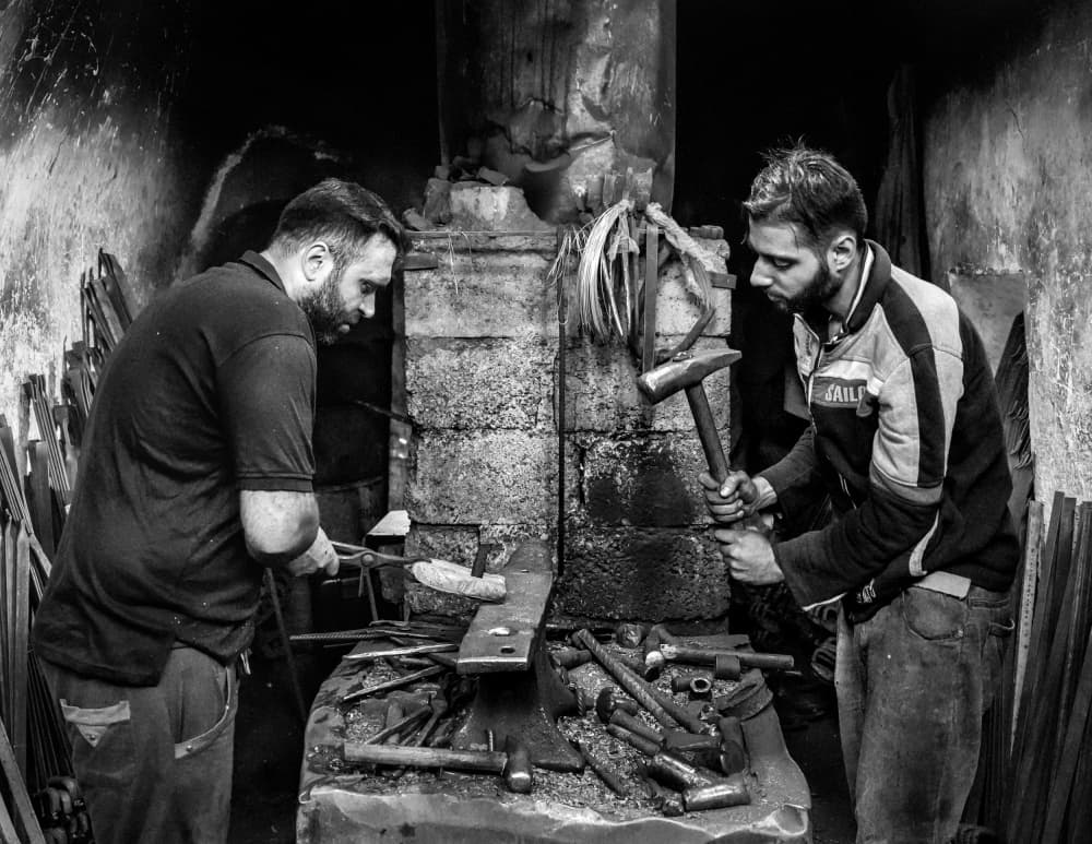 Blacksmiths at Work by Bashar Alsofey — canvas wall art