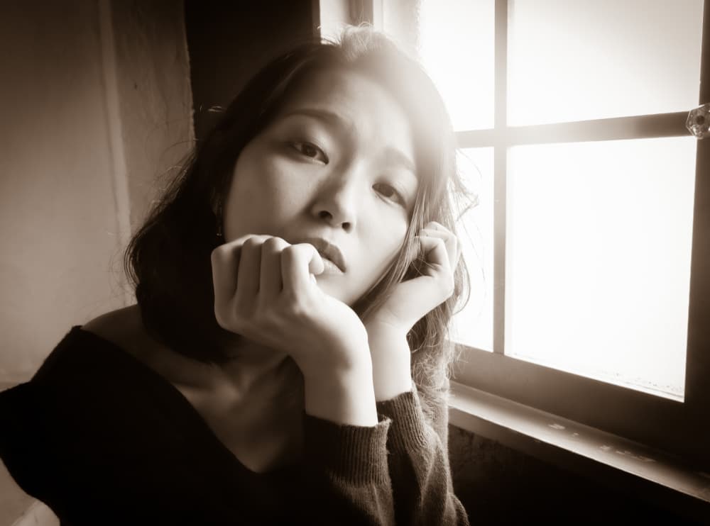 Pensive Woman Window Light by GABA — canvas wall art