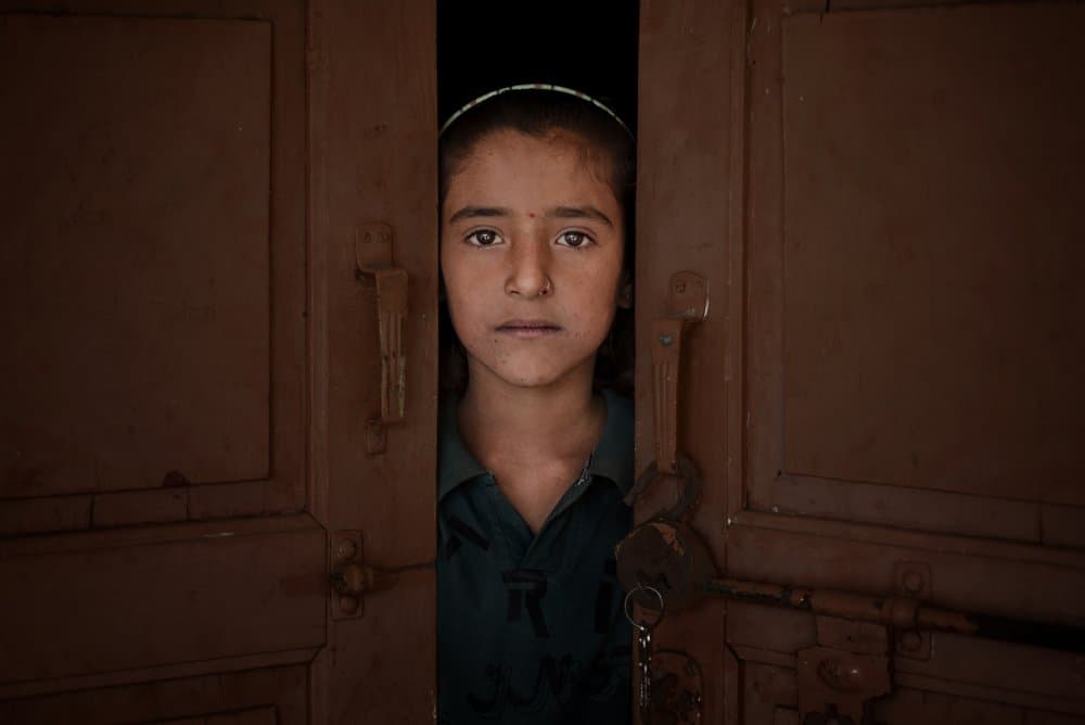 Curious Girl Peeks by Vivek Kalla — canvas wall art