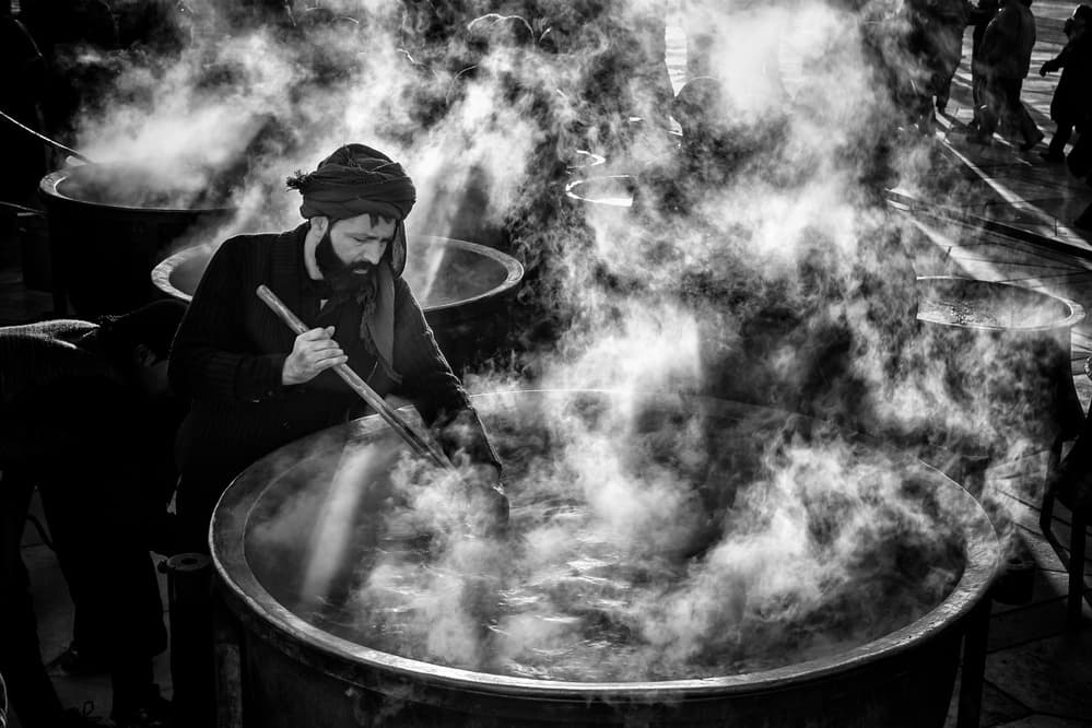 Man Cooking Steaming Pots by Mohammadreza Momeni — canvas wall art