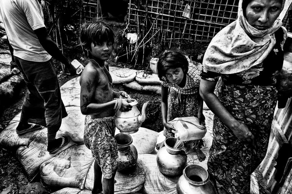 Children Collecting Water by Joxe Inazio Kuesta Garmendia — canvas wall art