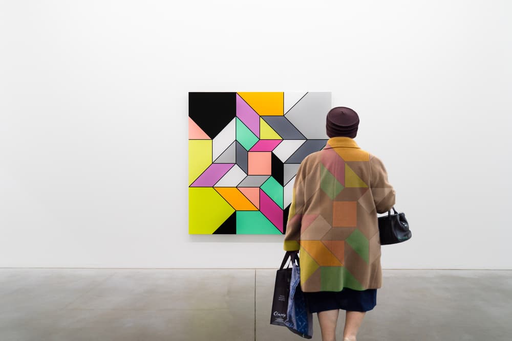 Woman Viewing Geometric Art by Luc Vangindertael (laGrange) — canvas wall art