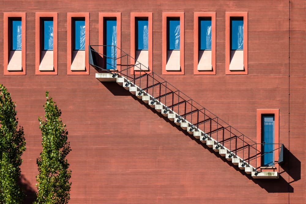 Diagonal Stairs Red Facade by Franco Tessarolo — canvas wall art