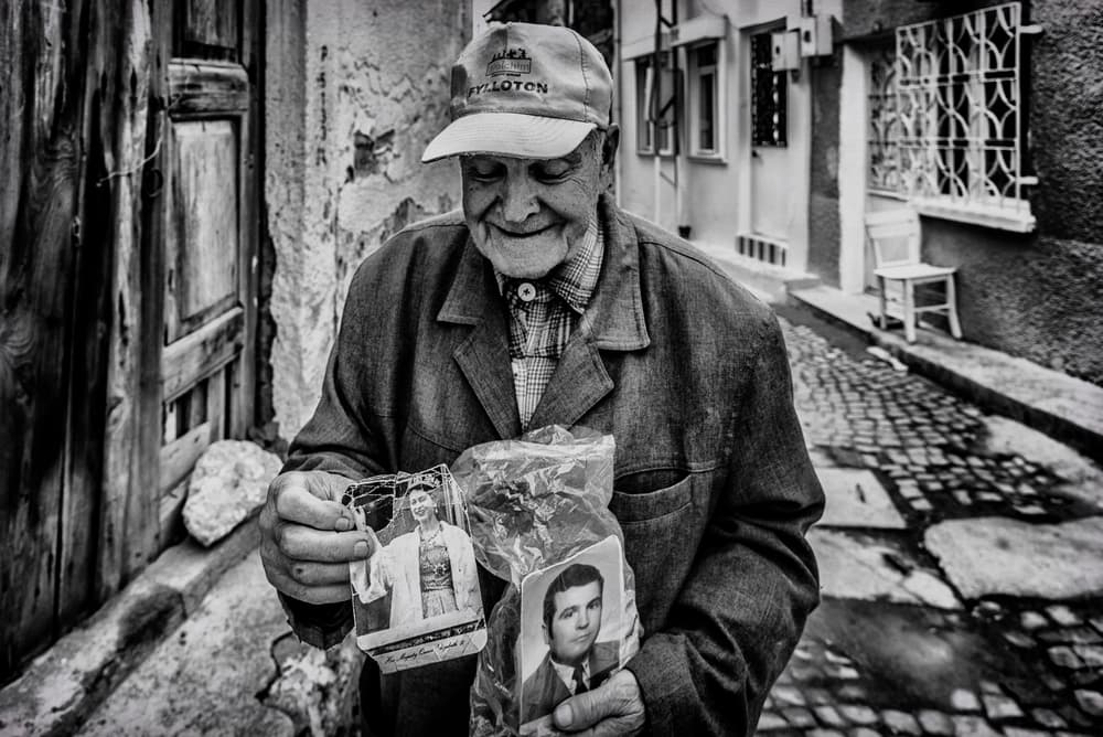 Joyful Man Holding Memories by Ömer Ates Kızıltug — canvas wall art