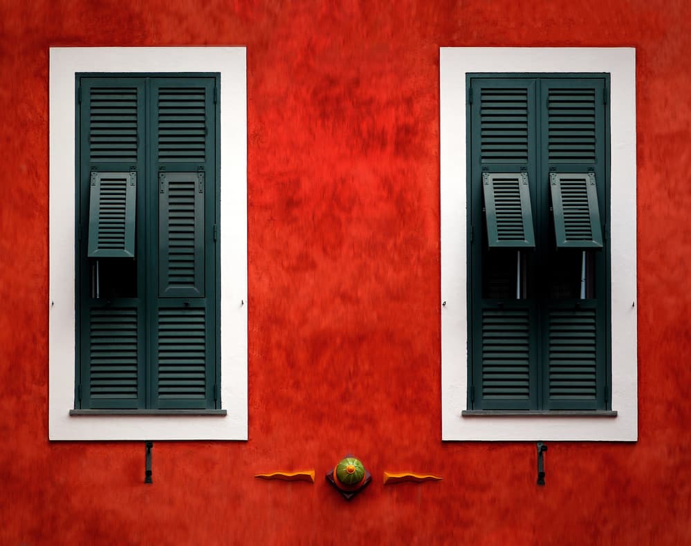 Red Wall Green Shutters by Hans-Wolfgang Hawerkamp — canvas wall art