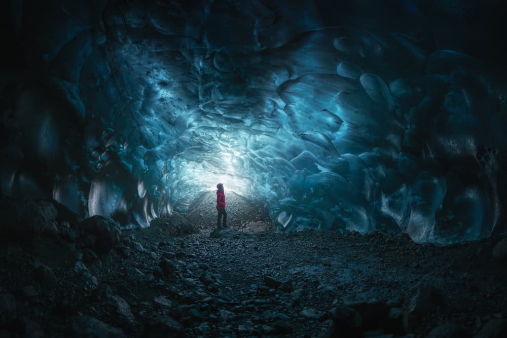 Blue Ice Cave Explorer by Nichole Chen — canvas wall art