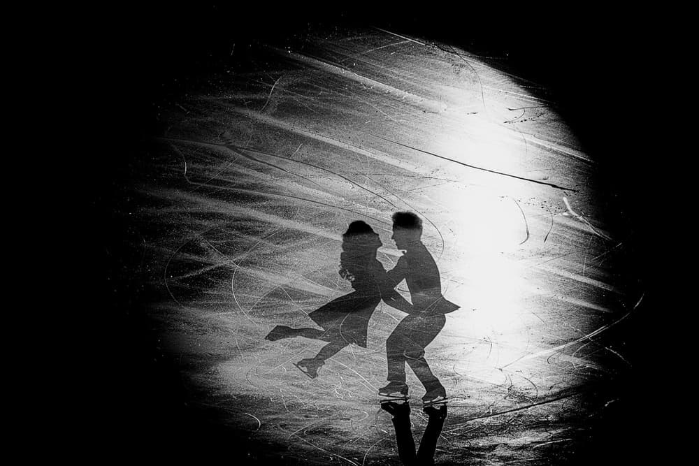 Skating Couple Spotlight by Roberto Parola — canvas wall art