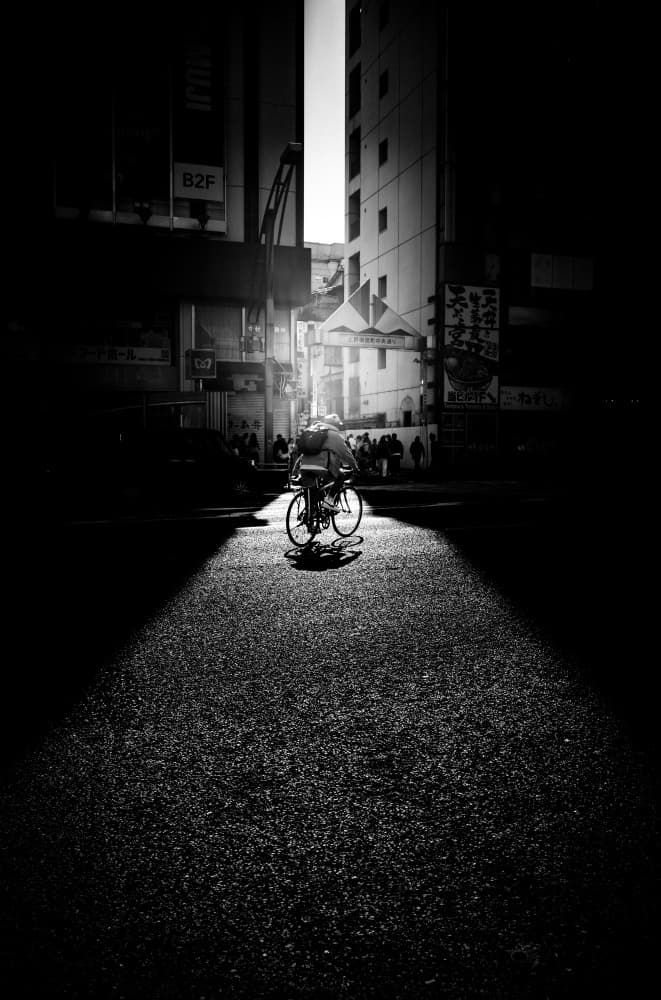 Cyclist In Dramatic Light by Kenichiro Tsukada — canvas wall art