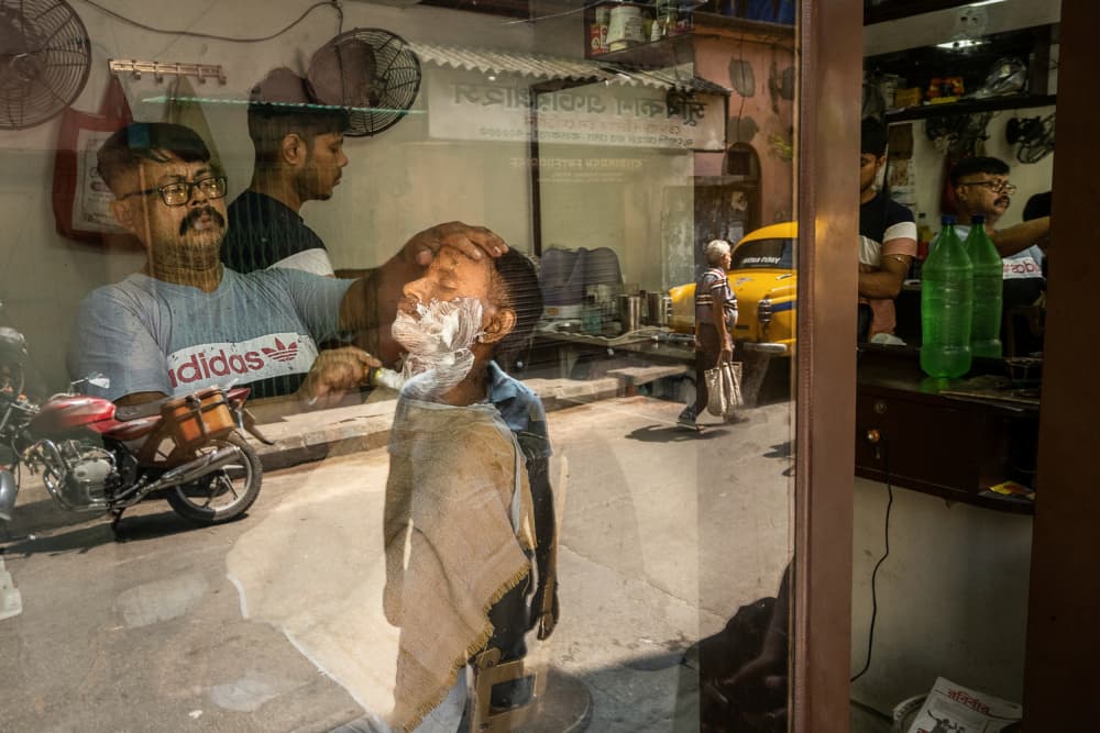 Kolkata Barbershop Street Scene by Kuntal Biswas — canvas wall art