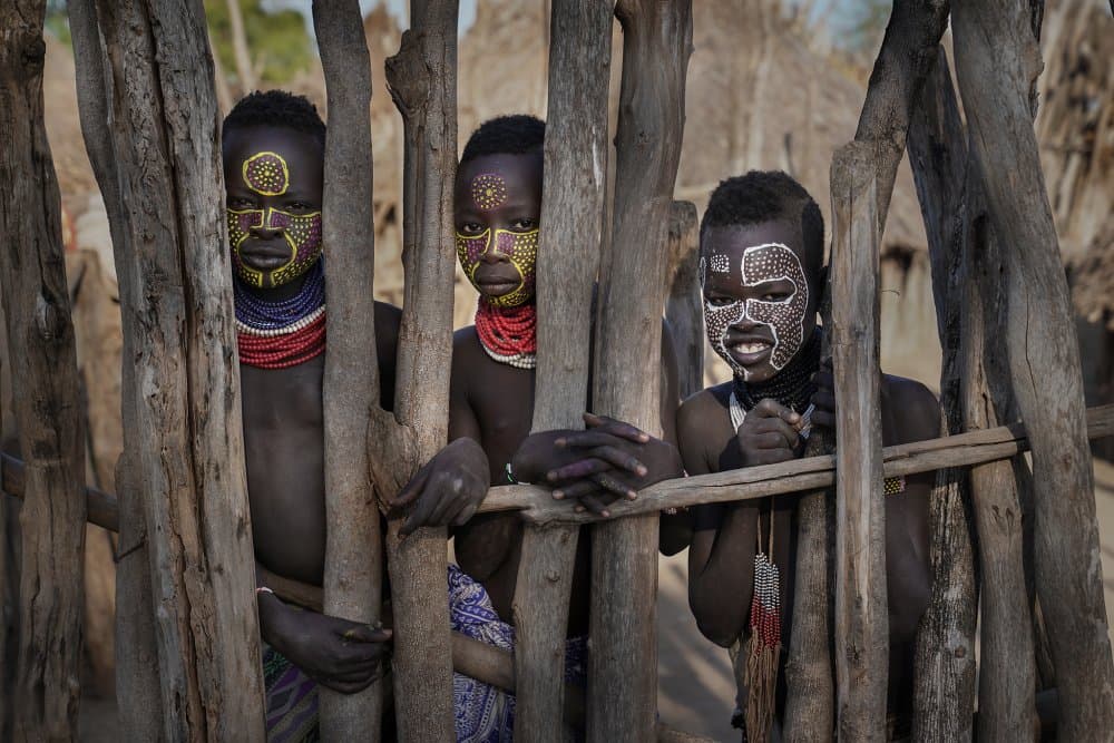 Painted Faces African Children by Sarawut Intarob — canvas wall art