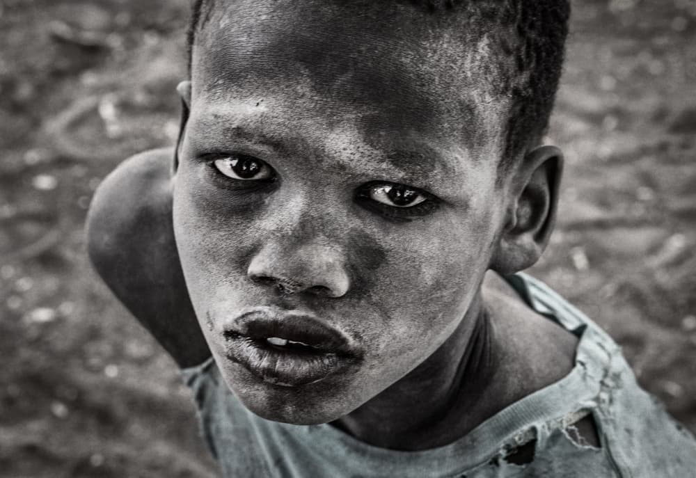 Boy's Soulful Gaze by Joxe Inazio Kuesta Garmendia — canvas wall art