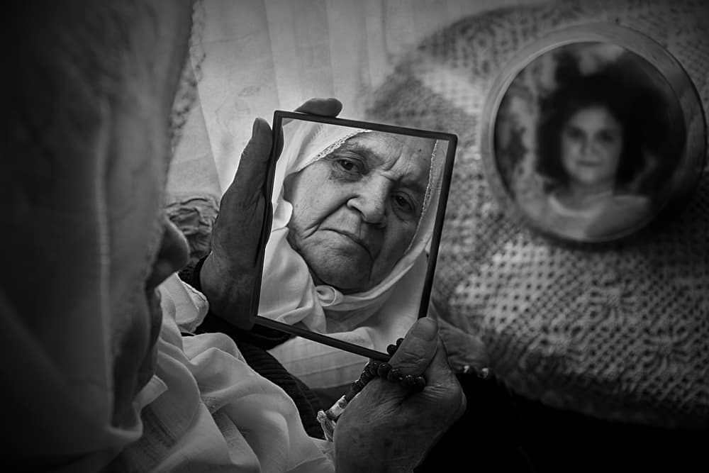 Elderly Woman's Reflection by Emine Basa — canvas wall art