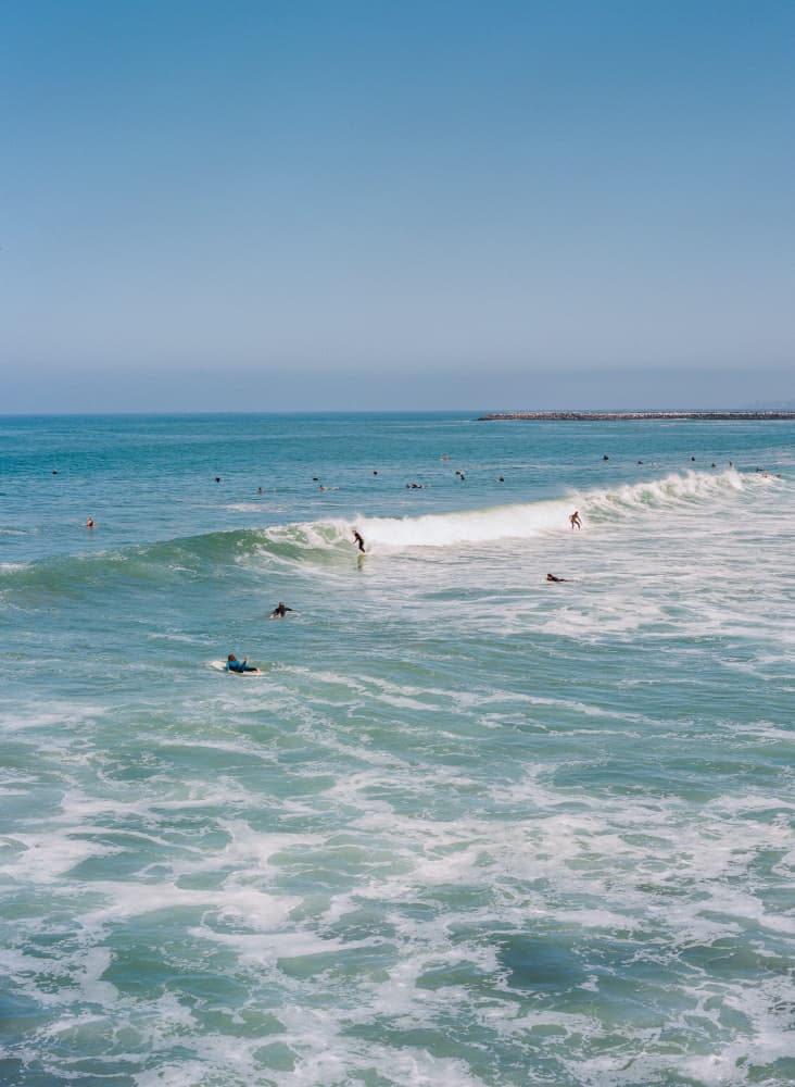 Sunny Coastal Surfing by Bethany Young — canvas wall art