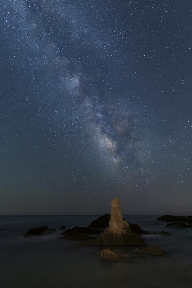 Milky Way Over Ocean Rock by Manuel Jose Guillen Abad — canvas wall art
