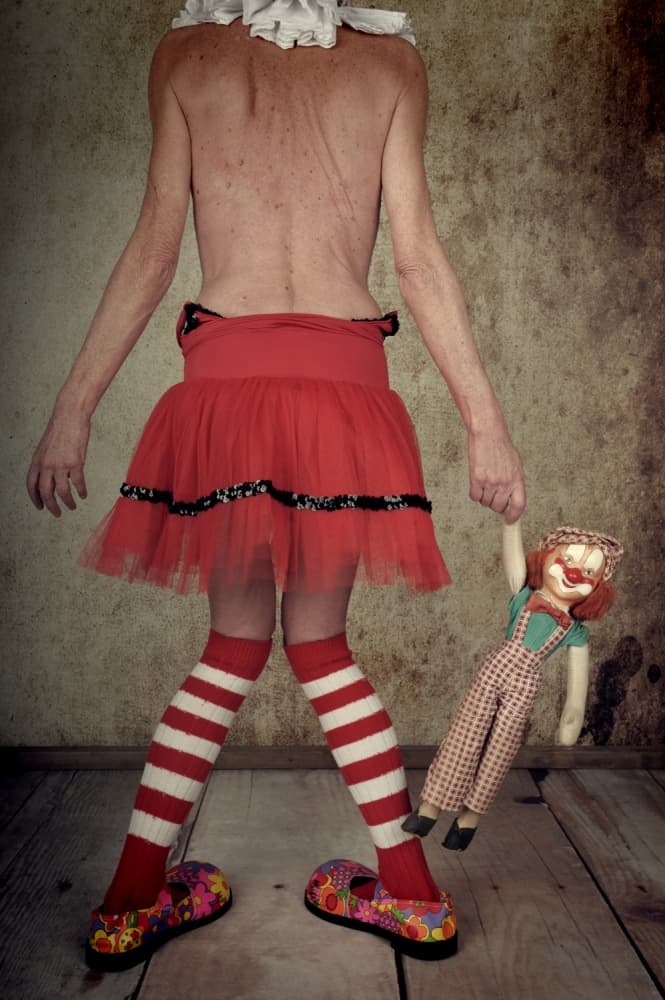 Vintage Clown Holding Doll by Monika Vanhercke — canvas wall art