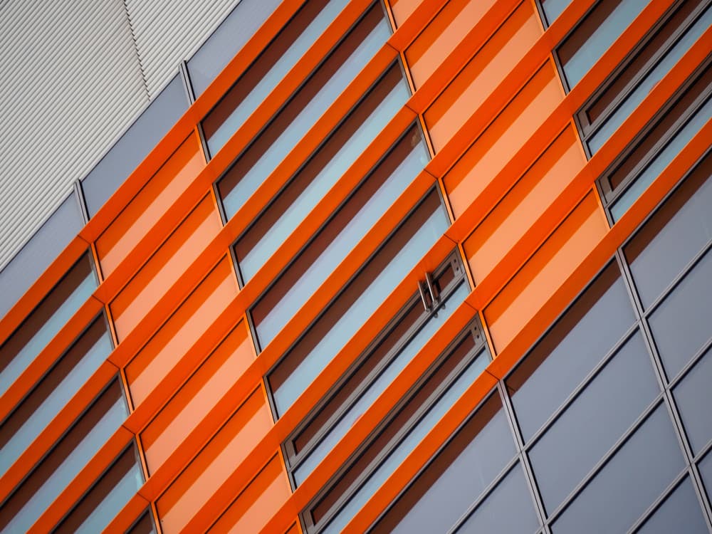 Orange Building Angles by Marius Surleac — canvas wall art