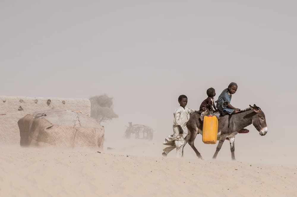 Desert Kids Carrying Water by Joxe Inazio Kuesta Garmendia — canvas wall art
