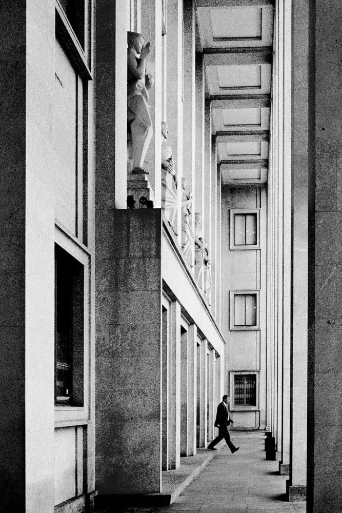 Man in Architectural Corridor by Paulo Abrantes — canvas wall art