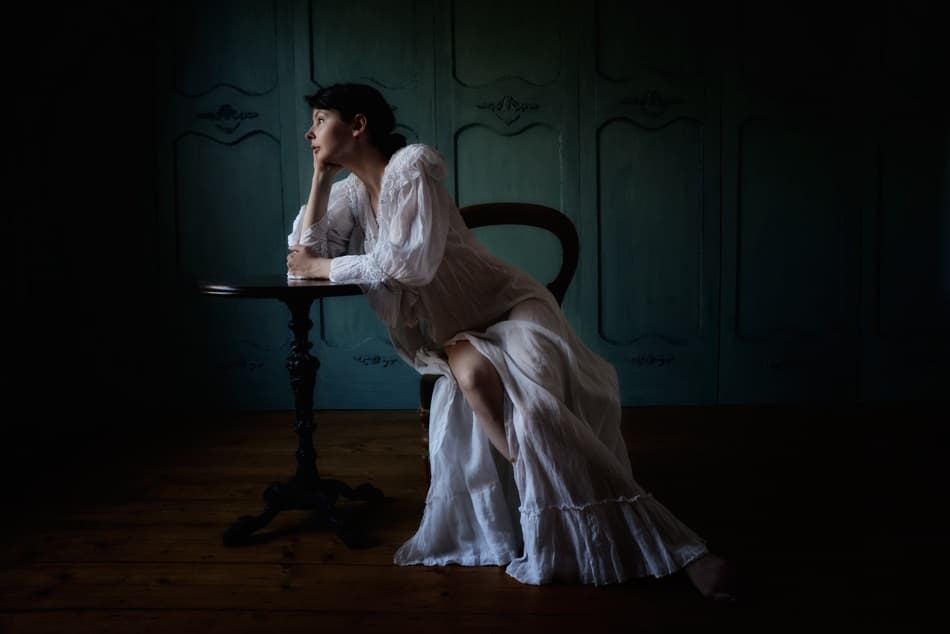 Thoughtful Woman In White by kenp — canvas wall art