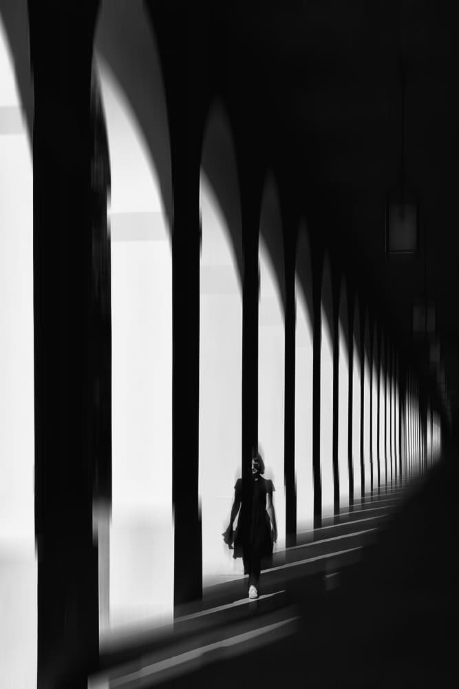 Woman Walking Arched Light by Jurij Bizjak — canvas wall art