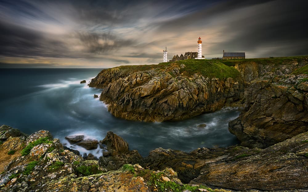 Moody Coastal Lighthouse by Krzysztof Browko — canvas wall art