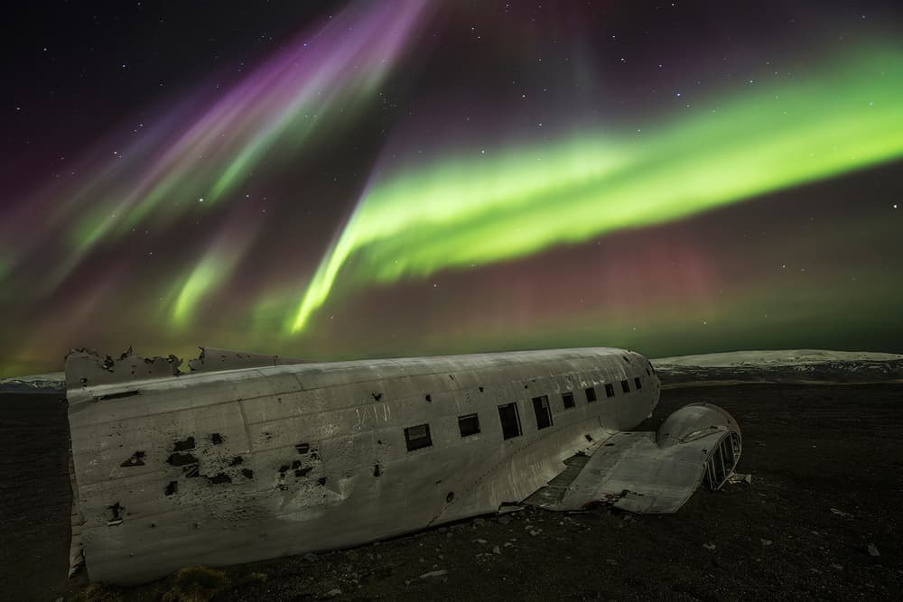 Aurora Over Plane Wreck by Bragi Ingibergsson - BRIN — canvas wall art
