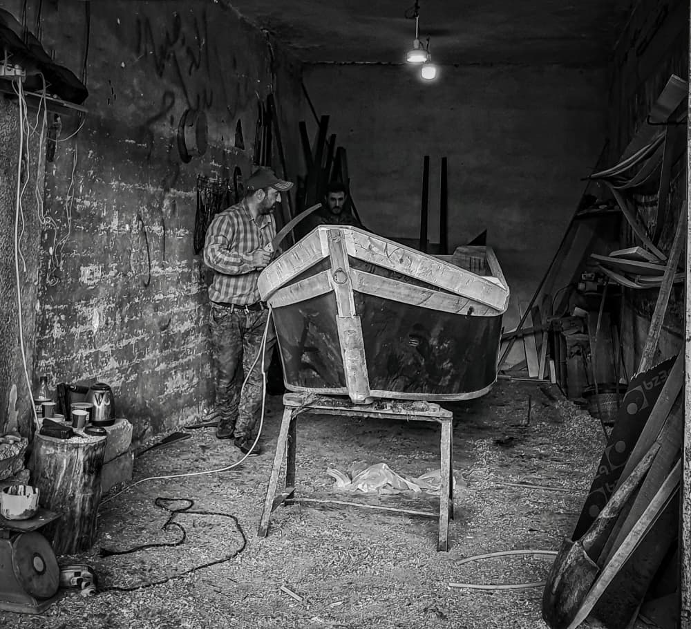 Boat Builders At Work by Bashar Alsofey — canvas wall art