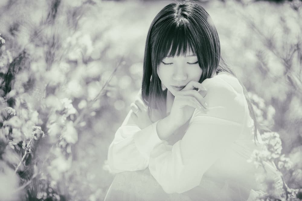 Pensive Woman Among Flowers by Daisuke Kiyota — canvas wall art