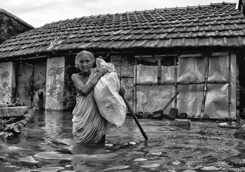 Woman in Flood Waters by Avishek Das — canvas wall art