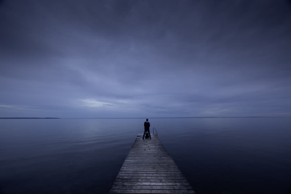 Man on Pier at Dusk by Clas Gustafson PRO — canvas wall art