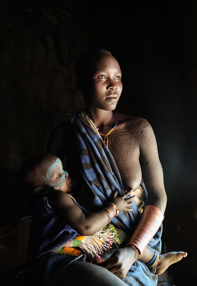 Tribal Mother and Child by Sarawut Intarob — canvas wall art