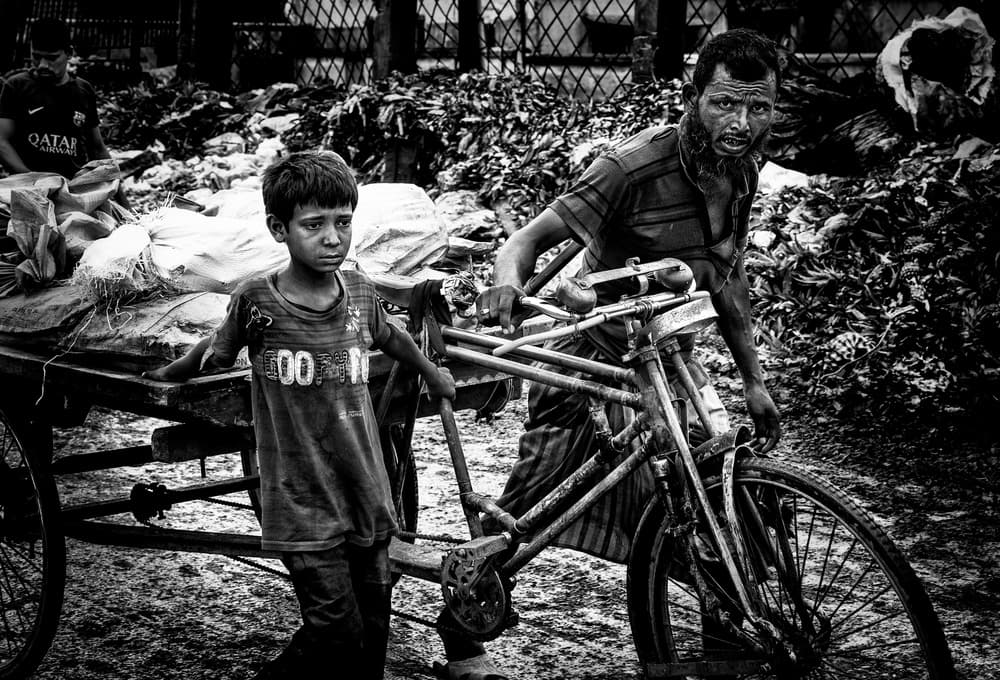 Man and Boy Working by Joxe Inazio Kuesta Garmendia — canvas wall art
