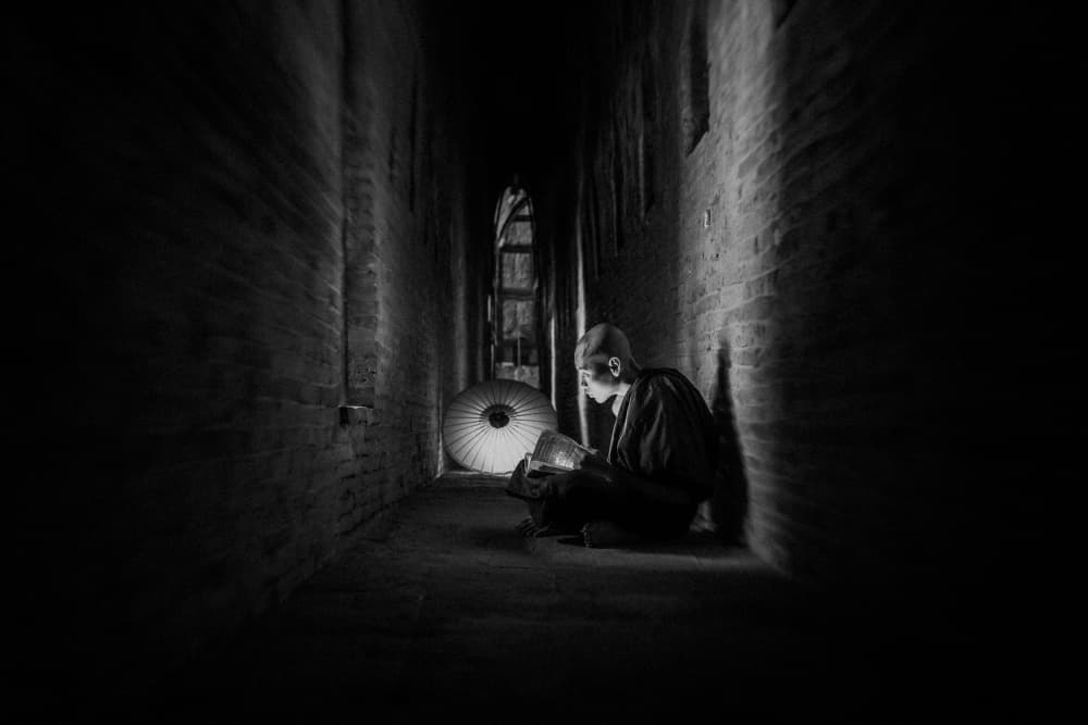 Monk Reading In Darkness by ADIREK M — canvas wall art