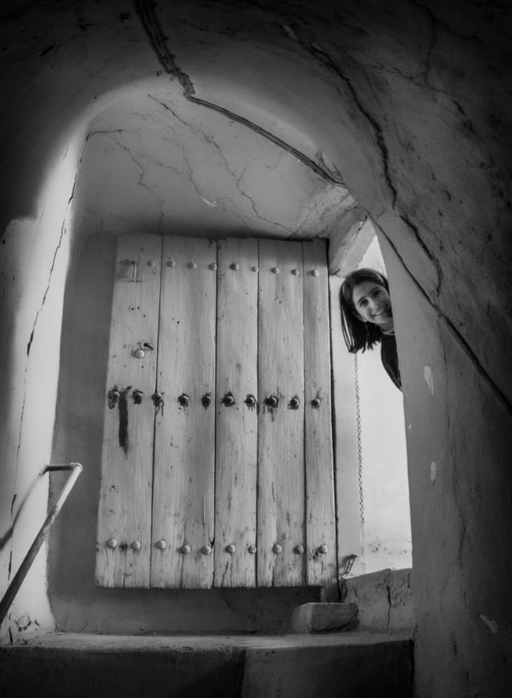 Woman Peeking from Door by Jalili — canvas wall art