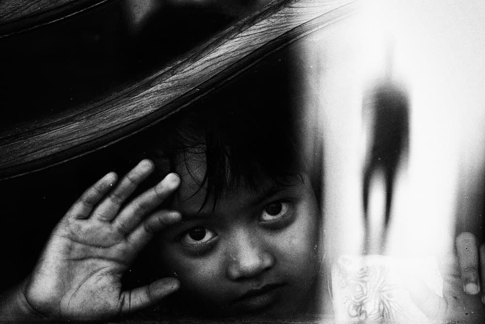 Curious Child's Gaze by Andi Halil — canvas wall art