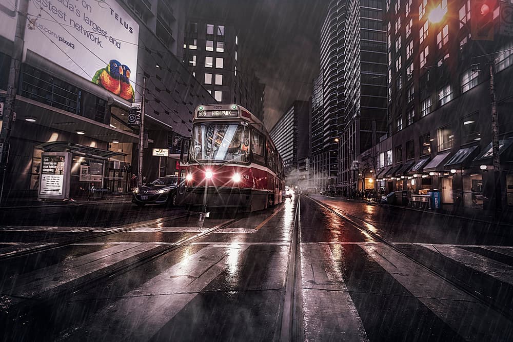 Rainy City Streetcar by Jackson Carvalho — canvas wall art
