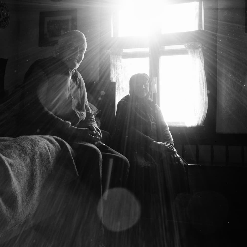 Senior Couple Sunlit Window by Zoran Toldi (EFIAP AZSF) — canvas wall art