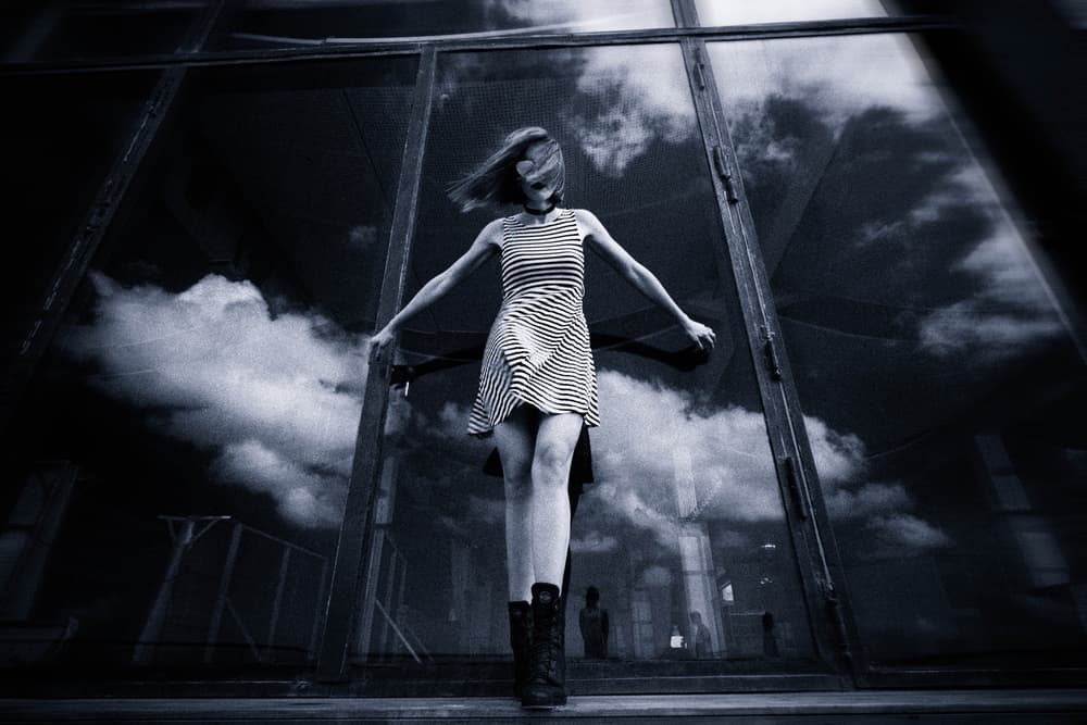 Woman In Sky Reflections by Yuri Shepelev — canvas wall art